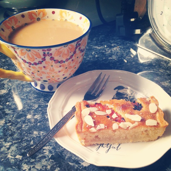 Pink grapefruit and almond slice with a cup of tea